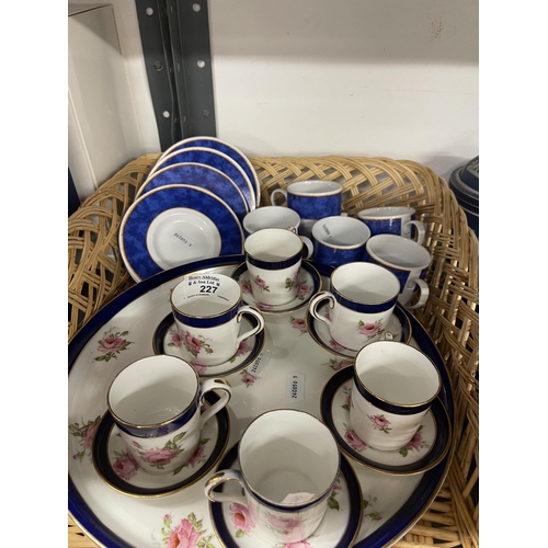 227 - Ceramics: Complete coffee set of six cups and saucers on a foot plate base, rose decoration by BISTO... 