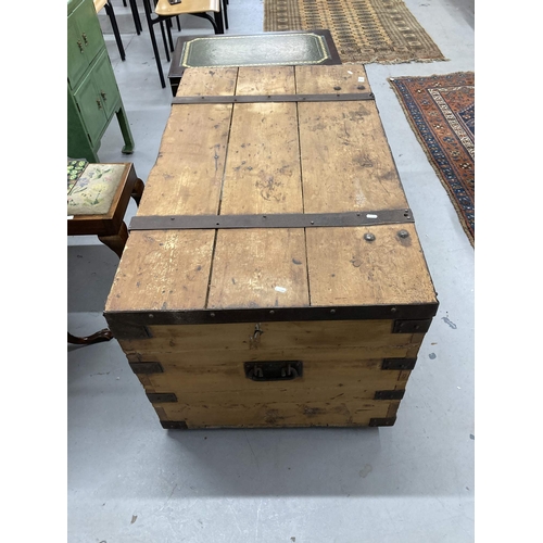 45 - Nautical: 19th cent. Steel-bound pitch pine sea chest with 19th century carriage label. 48ins. x 28i... 