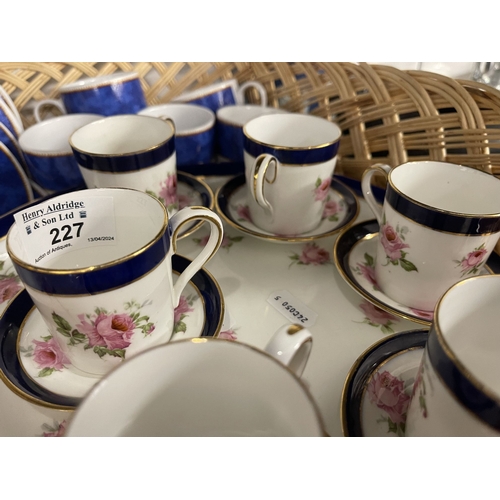 227 - Ceramics: Complete coffee set of six cups and saucers on a foot plate base, rose decoration by BISTO... 