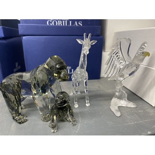 230 - Glass: Swarovski crystal endangered wildlife gorillas and baby, giraffe, eagle, all boxed with certi... 