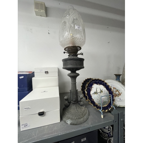 231 - Lighting: 20th cent. Oil lamp on single column with decorative shade. 27ins.