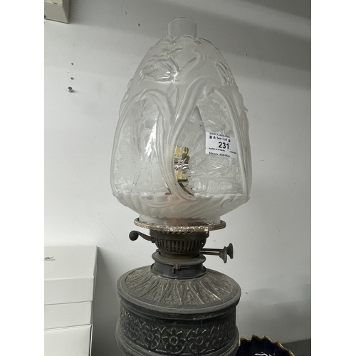 231 - Lighting: 20th cent. Oil lamp on single column with decorative shade. 27ins.