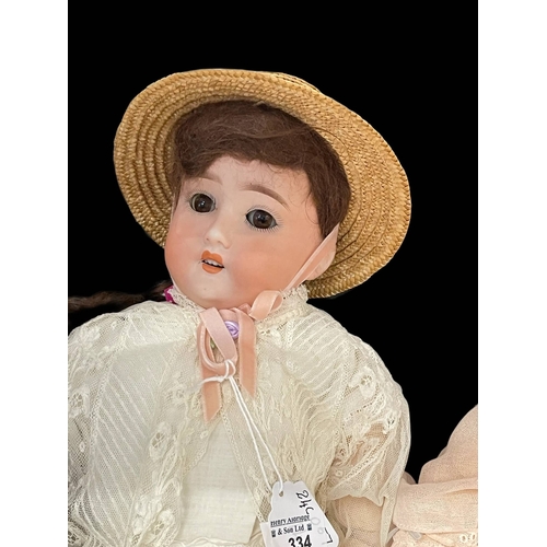 334 - Dolls: German made by Shoenaur & Hoffmeister, bisque socket head, open/shut brown glass eyes, cu... 