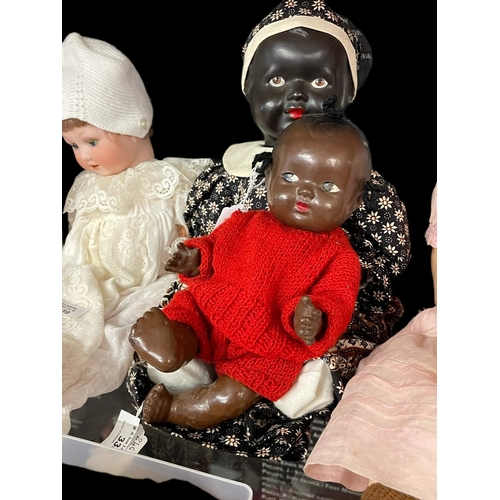 338 - Dolls: English-made c1945, black plastic, fixed eyes (painted), curved limb, marked Made in England ... 