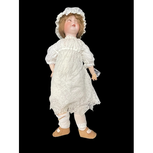 344 - Dolls: French made by S.F.B.J c1910, bisque socket head, weighted brown glass eyes, open mouth, four... 