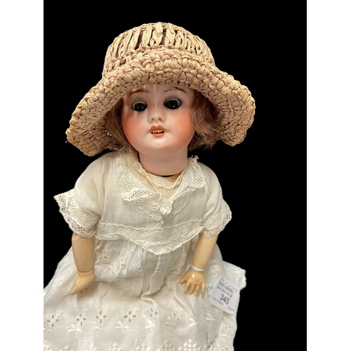 345 - Dolls: French made by S.F.B.J c1910, bisque socket head, weighted black glass eyes, open mouth, four... 