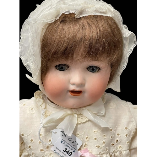 349 - Dolls: German made by Armand Marseille c1925, bisque socket head, weighted blue glass eyes, open mou... 