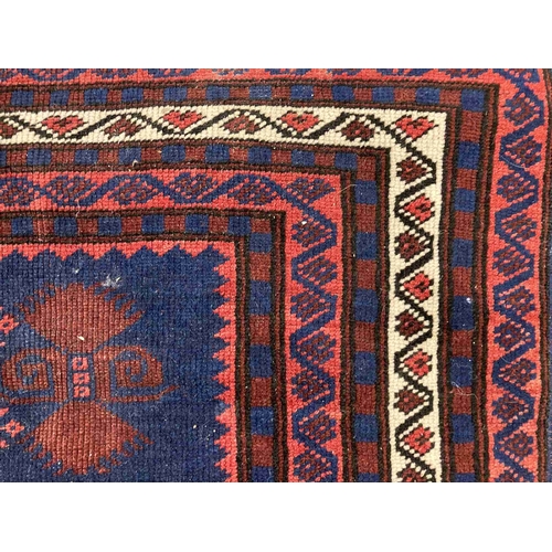 41 - Rugs: 20th cent. Anatolian/Turkish red/blue ground rug. 45ins. x 79ins.