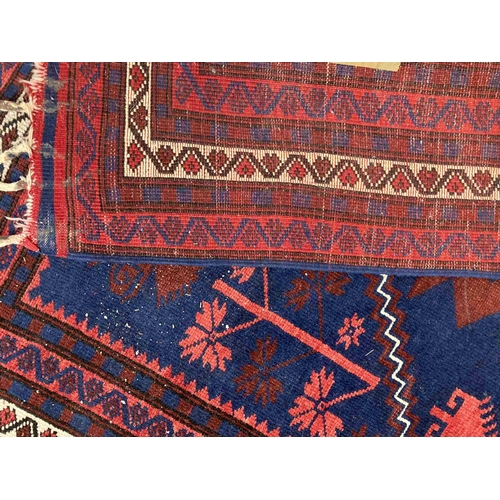 41 - Rugs: 20th cent. Anatolian/Turkish red/blue ground rug. 45ins. x 79ins.