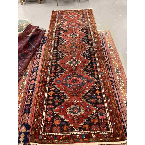 42 - Rugs: 20th cent. Iranian red ground Hemadan runner. 23ins. x 128ins.