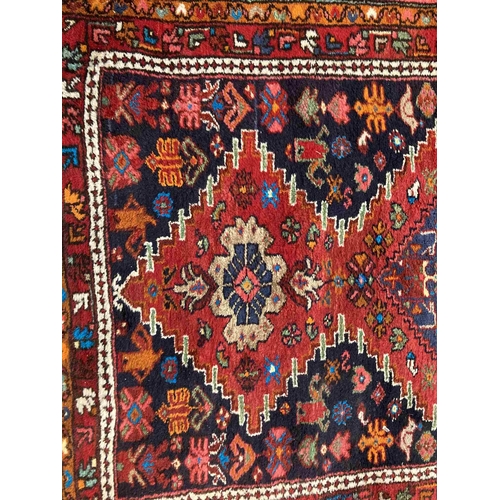 42 - Rugs: 20th cent. Iranian red ground Hemadan runner. 23ins. x 128ins.