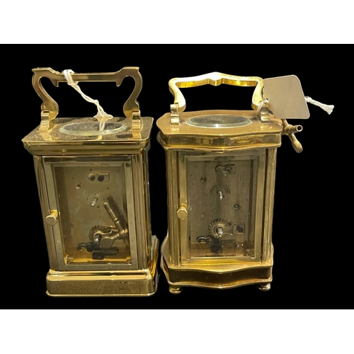 497 - Clocks: Brass carriage clock, white enamel, Roman numerals, serpentine front. Plus another of plain ... 