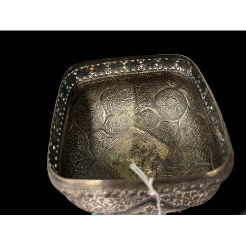 526 - Early 20th cent. Indian white metal bowl highly decorated on raised square base.