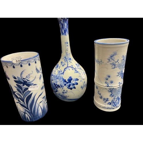 530 - Ceramics: Blue and white bottle vase painted with a bird amongst blossom, 24½cm, plus two further bl... 