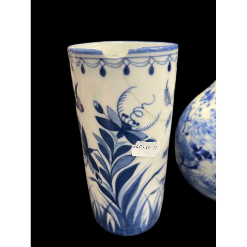 530 - Ceramics: Blue and white bottle vase painted with a bird amongst blossom, 24½cm, plus two further bl... 