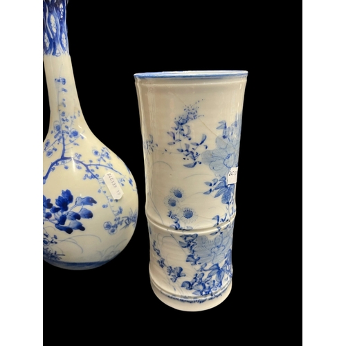 530 - Ceramics: Blue and white bottle vase painted with a bird amongst blossom, 24½cm, plus two further bl... 