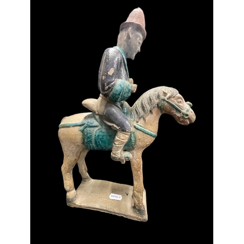 540 - Chinese: Chinese: Ming Period stoneware burial figure in the form of men on horseback in an aubergin... 