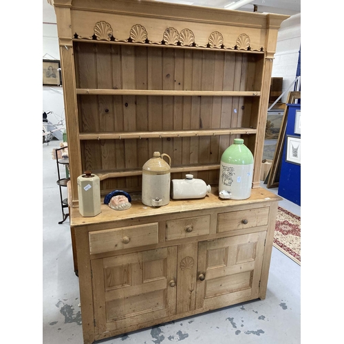 55 - Furniture: 20th cent. Pine dresser and rack the base three drawers over a twin door cupboard topped ... 