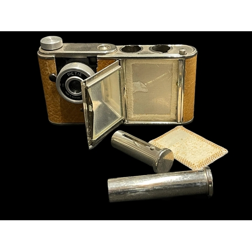 568 - Cameras: Petie Compact miniature camera tan body, single speed shutter, 11/25mm lens 'Leica'. In goo... 