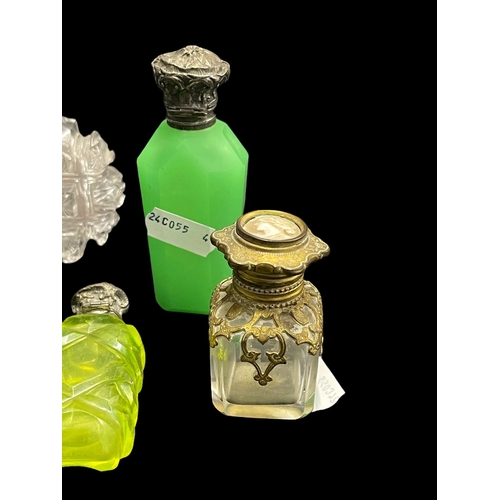 570 - Objects of Vertu: Victorian and later silver and white metal mounted scent bottles together with a p... 