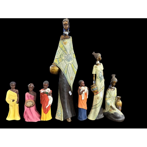 585 - Ceramics: Handpainted African figures by Sherratt & Simpson a young Masai girl 22cm, a young Mas... 