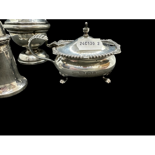 690 - Hallmarked Silver: Birmingham sugar shaker, pair of condiments and mustard pot with blue liner. 9oz.... 