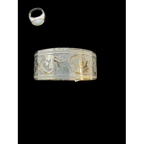 728 - Hallmarked Silver: Charles Horner engraved bangle, Chester 1944, a Clogau Welsh gold and silver ring... 