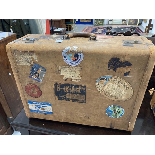 73 - Mid 20th cent. Travel: Tan leather suitcases with various travel labels of the period including Cuna... 