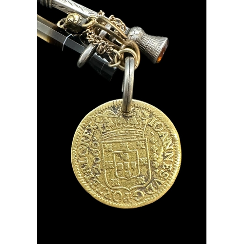 749 - Writing Requisites: Gold touch piece dated 1740, 9ct, 5.1g. Plus a silver pencil and seal.... 