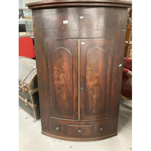 75 - Furniture: 19th cent. Bow fronted twin door corner cupboard single drawer below flanked by two false... 