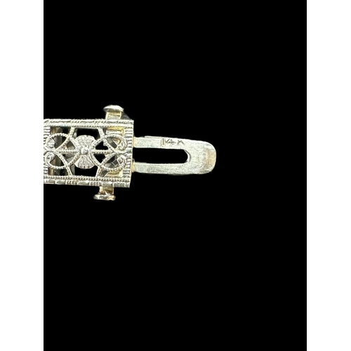 754 - Hallmarked Jewellery: White metal filigree panel bracelet set with a central round cut diamond and t... 