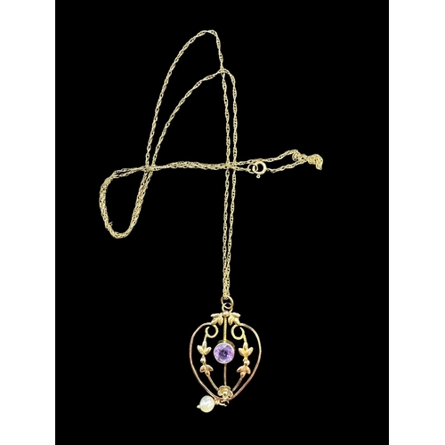 771 - Jewellery: Edwardian yellow metal open work pendant set with a central amethyst and a drop pearl, un... 