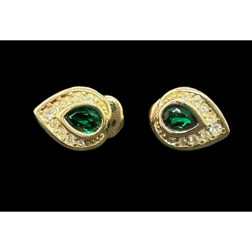 774 - Christian Dior: Teardrop shaped gilt metal clip on earrings set with green and white paste, a pair, ... 