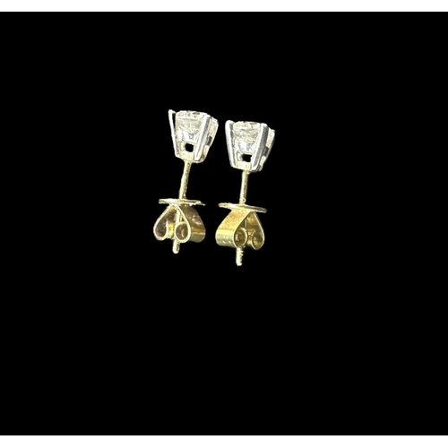 775 - Hallmarked Jewellery: Pair of 18ct gold earrings each set with a brilliant cut diamond, estimated we... 