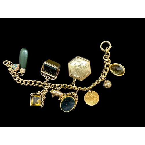 788 - Hallmarked Jewellery: 18ct gold bracelet with 10 charms attached, a 9ct gold heart set with turquois... 