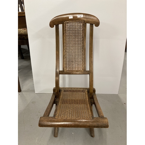 80 - Furniture: Early 20th cent. Child's rattan seat folding steamer chair.