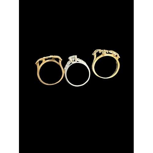 814 - Hallmarked Jewellery: A trilogy of gold rings, comprising an 18ct. white gold ring set with a centra... 