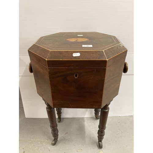 85 - 19th cent. Furniture: Mahogany cellarette with central inlaid cartouche, full fitted interior, the w... 