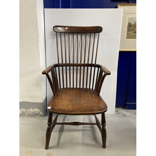 93 - Furniture: 18th cent. Elm comb back chair with H stretcher, turned supports and three-part arm, of g... 