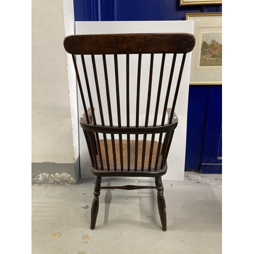 93 - Furniture: 18th cent. Elm comb back chair with H stretcher, turned supports and three-part arm, of g... 