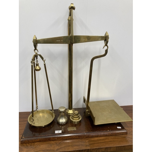 98 - Scientific Instruments: Scientific Instruments: Brass shop counter scales with weights, on mahogany ... 