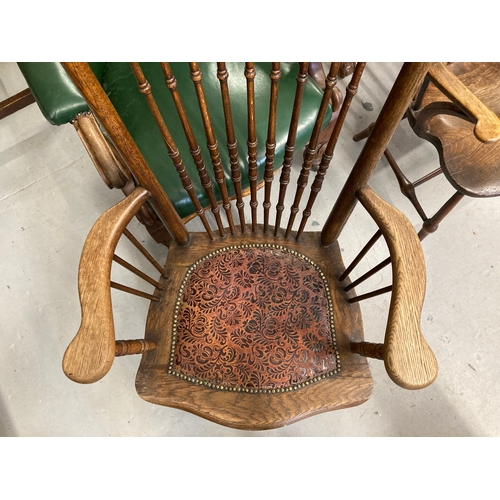 122 - Early 20th cent. Oak spindle back fireside chair with leather upholstered seat.