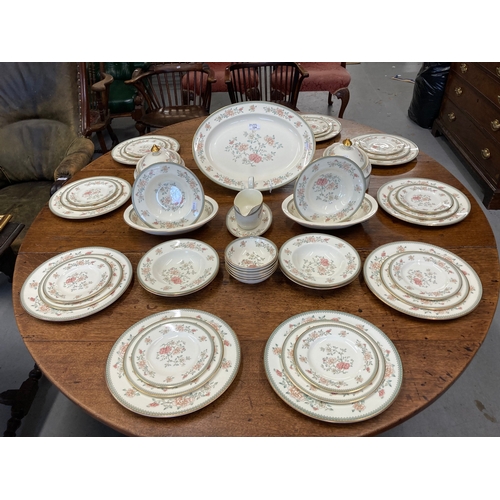 124 - Minton 'Jasmine' dinner services comprising 16ins oval, 10 x 10½ins plates, 10 x 8ins plates, 10 x 6... 