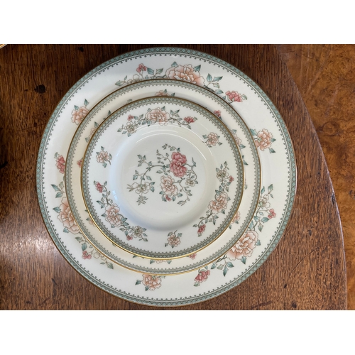 124 - Minton 'Jasmine' dinner services comprising 16ins oval, 10 x 10½ins plates, 10 x 8ins plates, 10 x 6... 