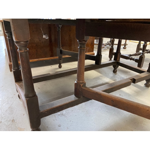 125 - 18th cent. Oak gate leg table of good colour. 64ins. x 54½ins. Extended.