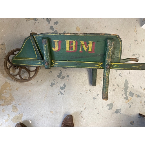 134 - 19th cent. Pine wheelbarrow green painted with J.B.M stencilled to the sides in yellow and red, shap... 