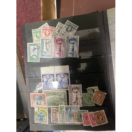 234 - Stamps: Two stock books and one album of mainly GB mint stamps including many unuse Elizabeth II blo... 