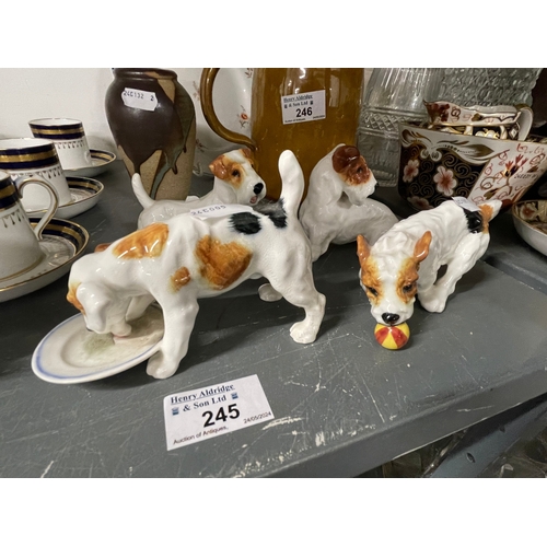 245 - Mid 20th cent. Royal Doulton dogs, HN1158 hound with plate, HN1097 terrier with ball, HN2508 fox ter... 