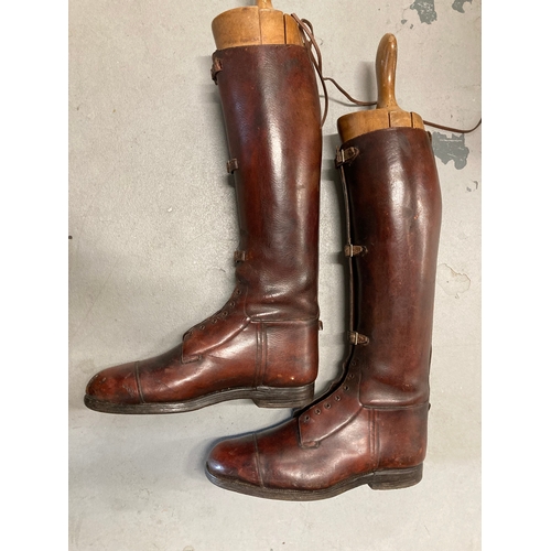 4 - Militaria: Pair of tan leather WWI riding boots with wooden trees. Maker's name inside.