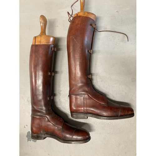 4 - Militaria: Pair of tan leather WWI riding boots with wooden trees. Maker's name inside.